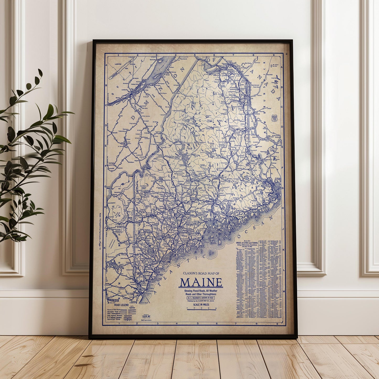 a framed map of Maine, with a detailed and intricate design.