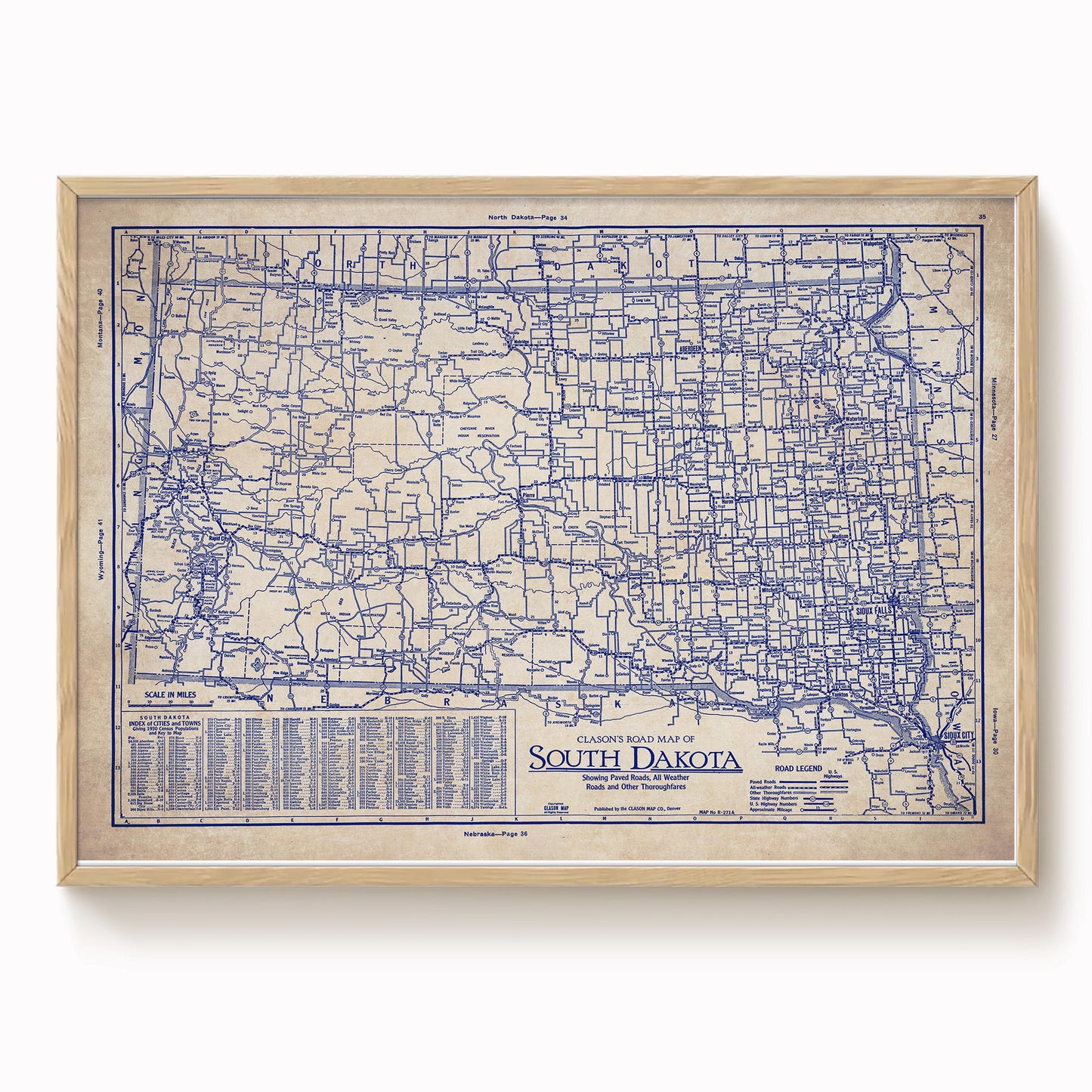 The image is a framed vintage map of South Dakota, showing the state's roads and highways in a detailed and detailed manner.