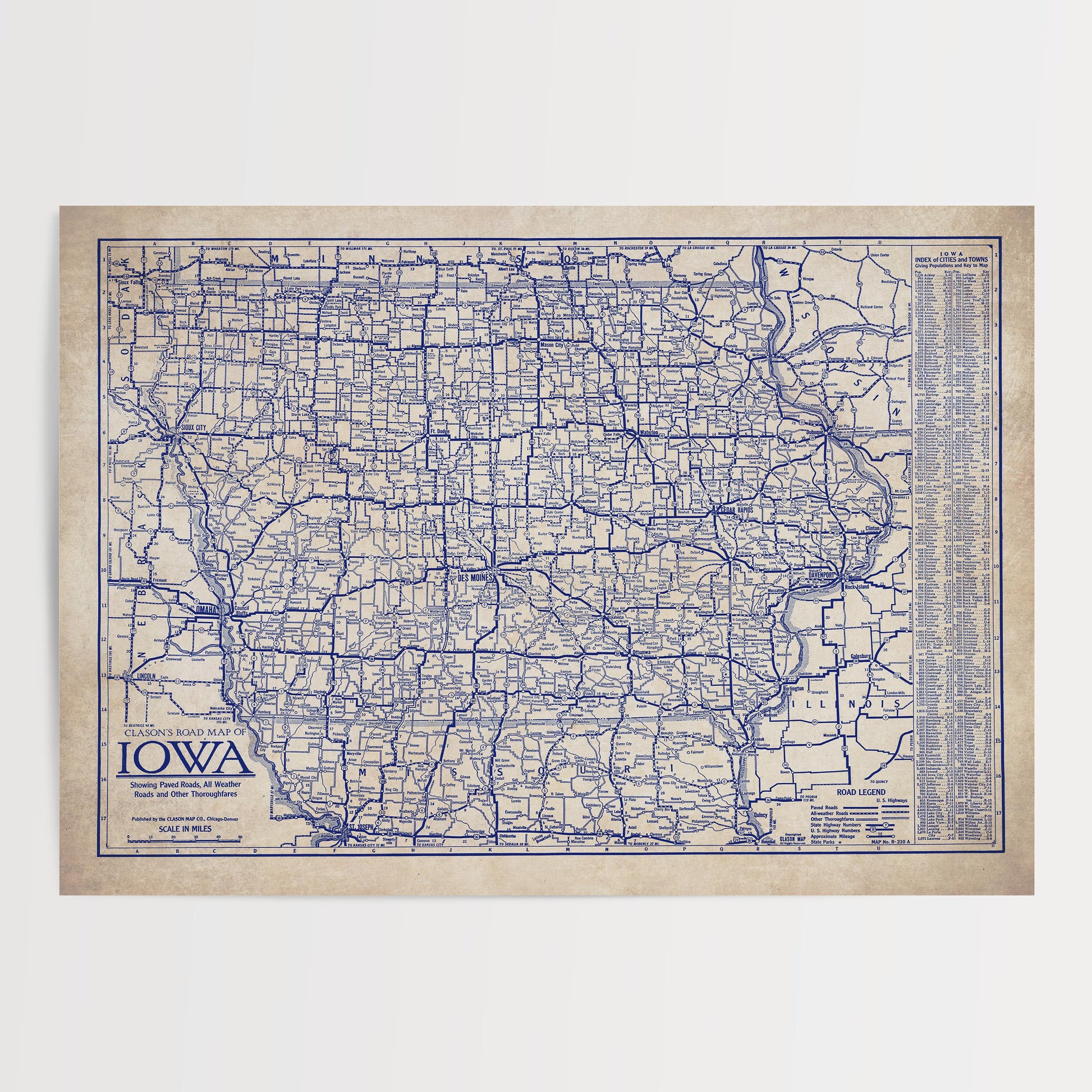 The image is a vintage map of Iowa, showing the state's roads and highways in a detailed and intricate manner.