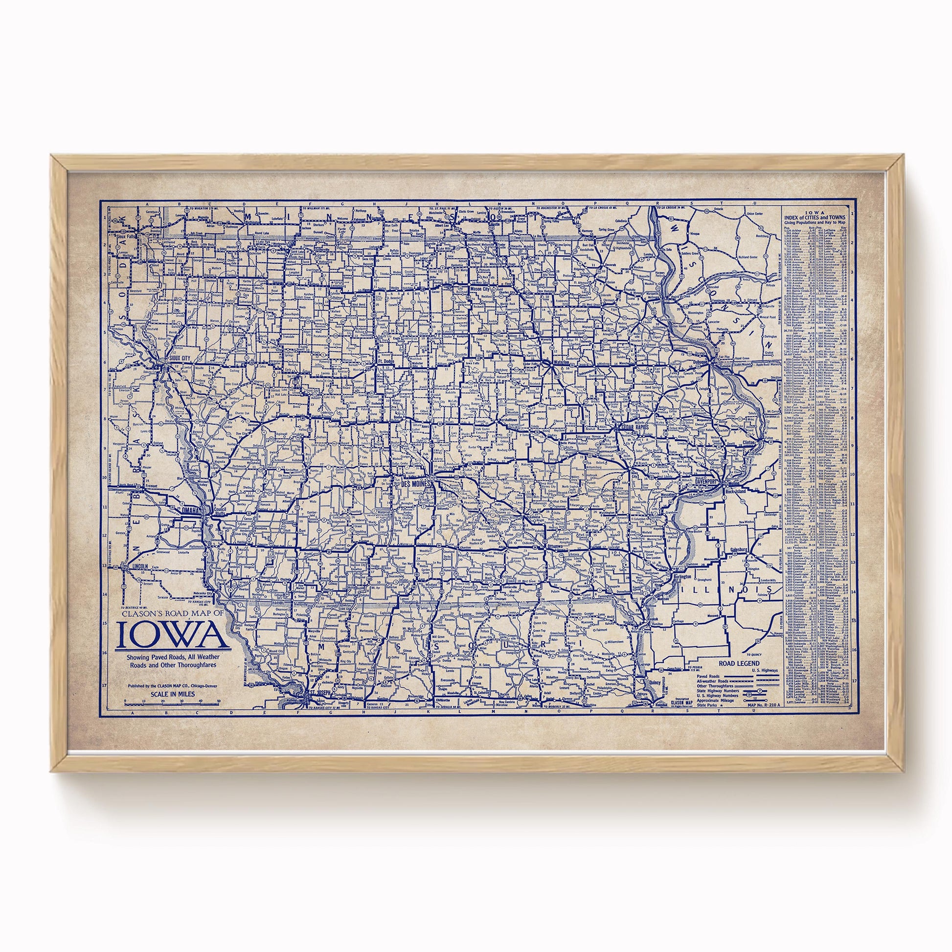 The image is a framed vintage map of Iowa, showing the state's roads and highways in a detailed and intricate manner.